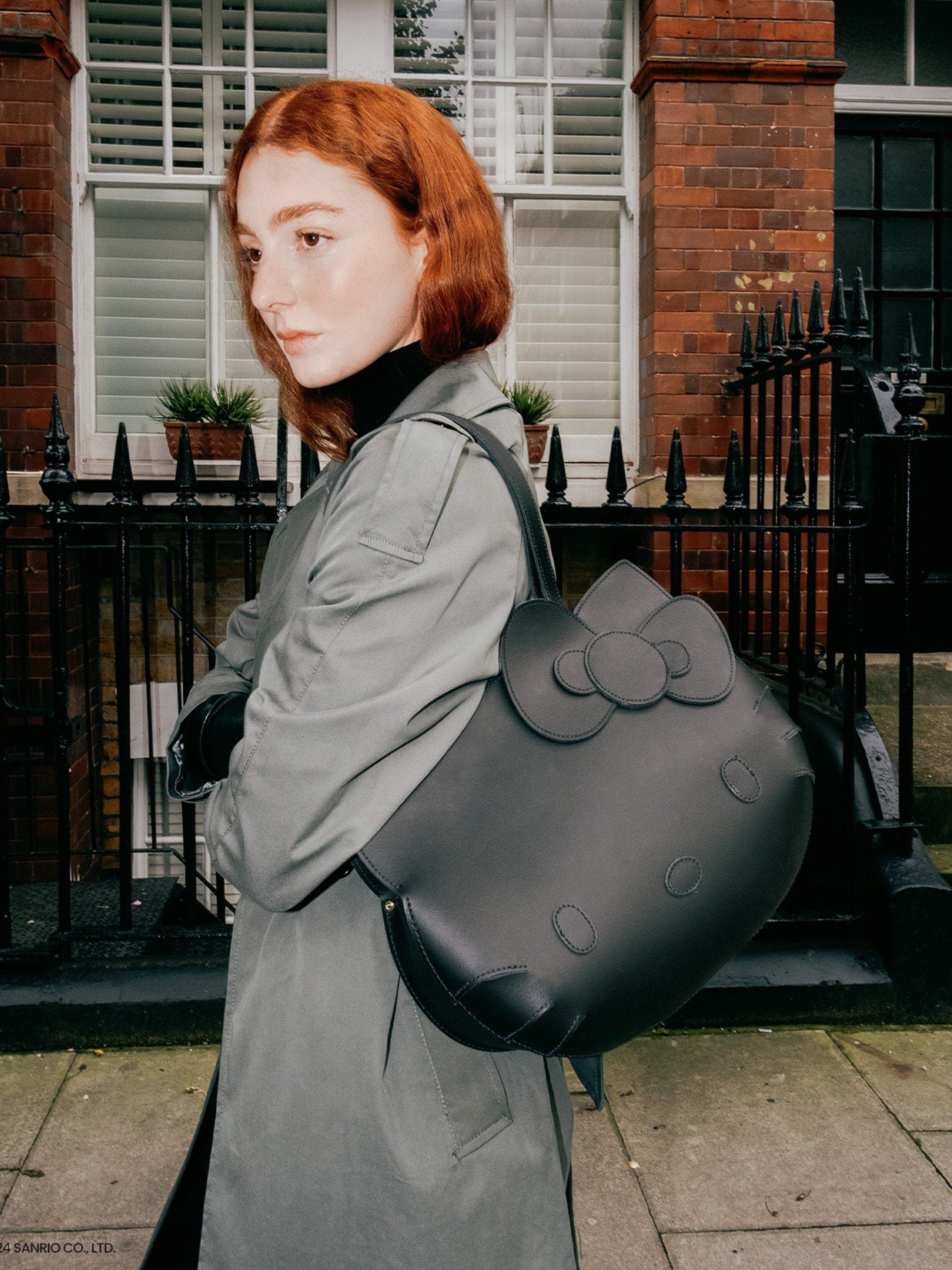 Hello Kitty Face Leather Tote Bag In Black Cambridge Satchel